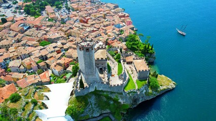 View of the Scaliger Castle from Malcesine - Lake Garda - 4k drone footage