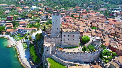 View of the Scaliger Castle from Malcesine - Lake Garda - 4k drone footage