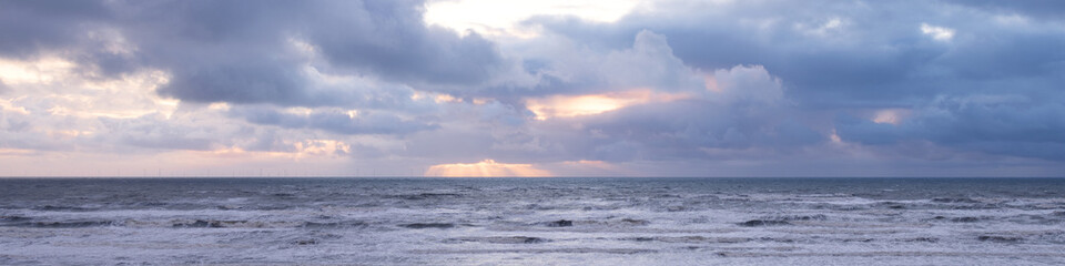 Banner sunset with clouds over the North Sea