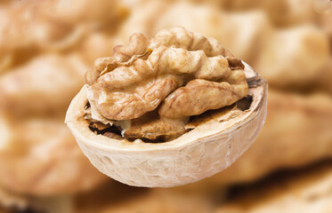 Walnuts background. Cracked open Walnuts. Healthy food ingredient texture. Single object isolated.