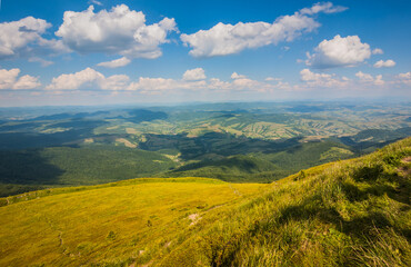 Beautiful view of the Ukrainian mountains Carpathians and valleys.Beautiful green mountains in summer with forests and grass. Water-making ridge in the Carpathians, Carpathian mountains