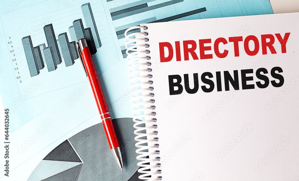 Poster directory business text on a notebook with pen on a chart background
