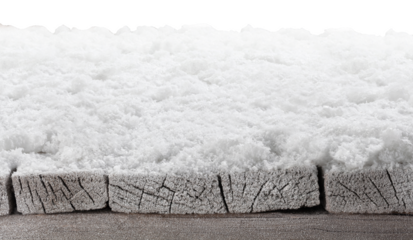 Wooden table with snow for product placement