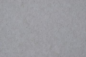 A sheet of gray recycled cardboard texture as background

