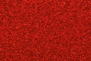 Red defocused glitter texture as background
