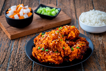 Spicy korean fried chicken with pickled radish and rice