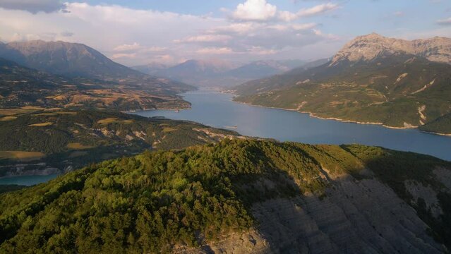 Aerial view of Serre-Poncon lake with Grand Morgon peak, Chanteloube Bay and Savines-le-Lac village in the distance. Durance Valley, Hautes-Alpes (Alps), France