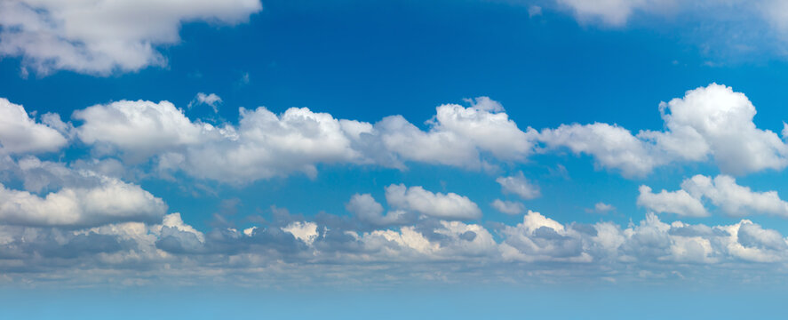 Cloudscape - Panorama of real blue sky during daytime with white light clouds Freedom and peace. Large photo format