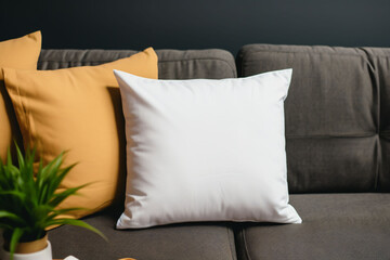 Blank white pillow on a modern sofa, pillow mockup