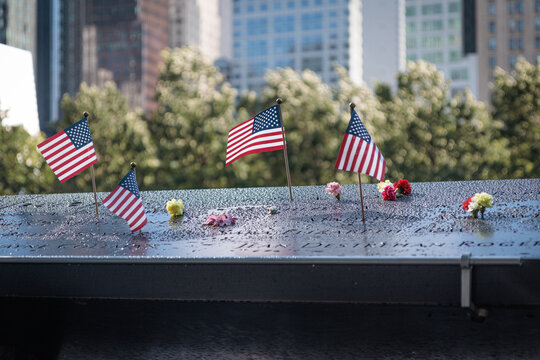 National September 11 Memorial, american flag, flowers, names, New York, USA