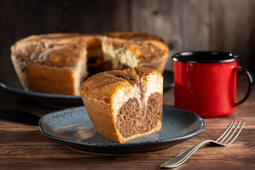 Marble cake and cup of coffee on the table.