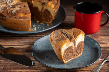 Marble cake and cup of coffee on the table.