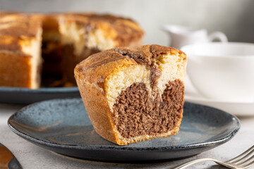 Marble cake and cup of coffee on the table.