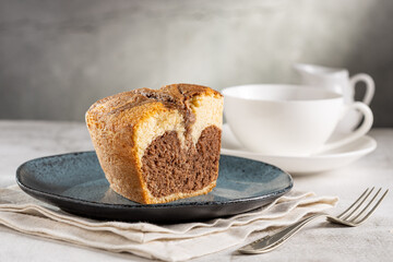 Marble cake and cup of coffee on the table.