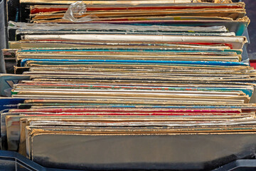 Pile of cardboard records on market
