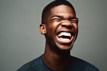Fototapeta premium cropped shot of a handsome young man laughing with excitement