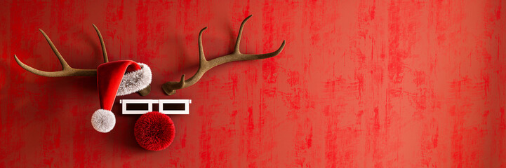 Christmas greeting card design. Reindeer with red nose and Santa hat  on vibrant red background with copy space.. 3D Rendering, 3D Illustration © hd3dsh