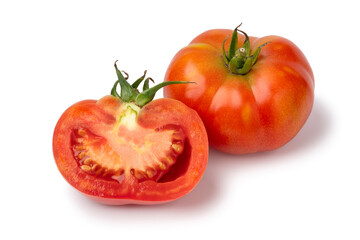 Whole and halved Galapagos tomato isolated on white background close up