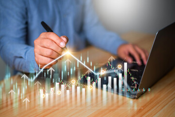 Investment and financial concept, Interest rate and dividend, Businessman  working with digital finance technology of invest strategy for perceptive financial business decision.