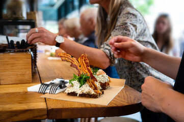 Open sandwich with bacon and tuna salad, danish smorrebrod for lunch.