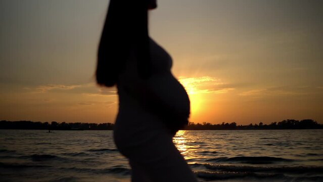 A poignant moment unfolds the silhouette of a preg