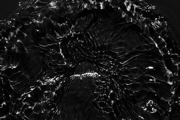 Water black surface abstract background. Waves and ripples texture of cosmetic aqua moisturizer...