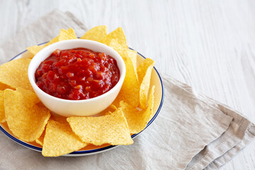 Homemade Salsa and Tortilla Chips on a Plate, side view. Space for text.
