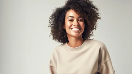 Gordijnen Beautiful african american girl with an afro hairstyle smiling. Smiling beautiful afro girl. Curly black hair. Emotion concept. © BlazingDesigns