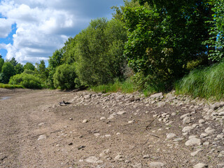 drained river bed with no water is summer
