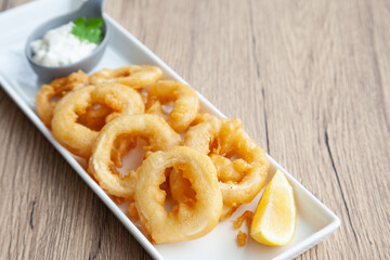 Crispy fried squid, Calamari  with tartar sauce and lemon