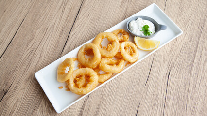 Crispy fried squid, Calamari  with tartar sauce and lemon