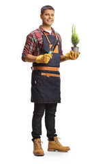Full length portrait of a gardener holding a plant in a pot and a spade