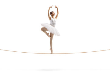 Full length shot of a ballerina dancing on a tightrope