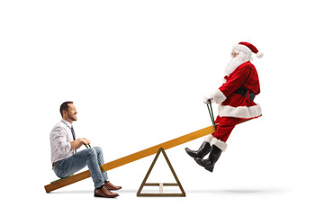 Businessman and santa claus playing on a seesaw
