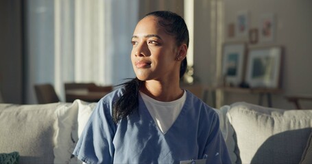 Calm, thinking and a nurse or woman on the sofa to relax from a career in healthcare in a house....