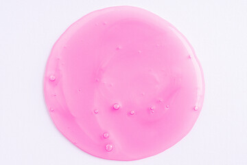 Transparent pink cosmetic sample texture with bubbles. Cosmetic shower gel. Cosmetic rose pink serum, beauty background.