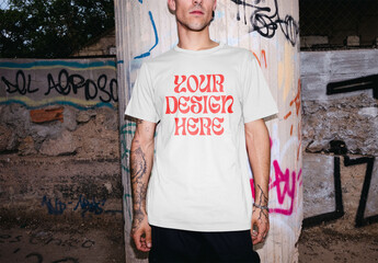 Mockup of man wearing t-shirt with customizable color in urban setting, front view with flash