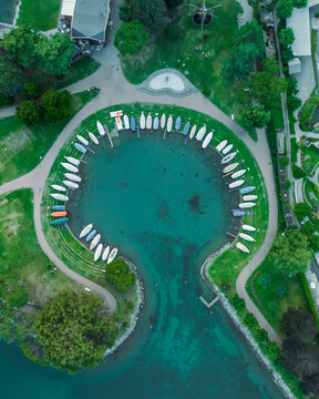 Aerial view of sailing boats docked along the pier in Melide, a small town along the Lugano Lake in Ticino, Switzerland.