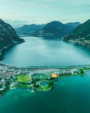 Aerial view of Melide, a small town along the Lugano Lake at sunset in Ticino, Switzerland.