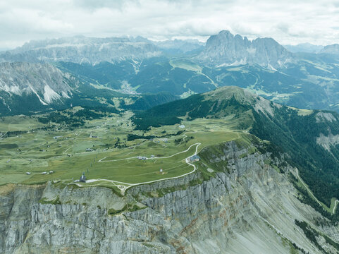 Aerial view of Seceda, a popular mountain peak on the Dolomites in the Odle/Geisler Group situated within Puez-Odle Nature Park in South Tyrol in Northern Italy.