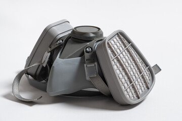 Respirator with dust and gas filters on a white background.