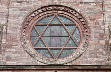 Fototapeta na wymiar Stained Glass Window with Six-Point Star in Basel Minster