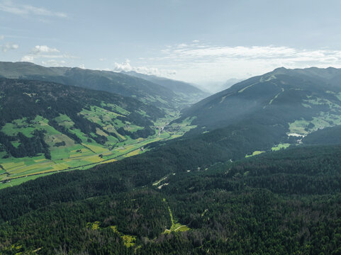 Aerial view of Versciaco town as seen from Croda dei Baranci (Birkenkofel) mountain peak on the Dolomites range, Trentino, South Tyrol, Italy.