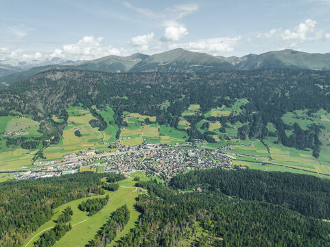 Aerial view of San Candido town as seen from Croda dei Baranci (Birkenkofel) mountain peak on the Dolomites range, Innichen, Trentino, South Tyrol, Italy.
