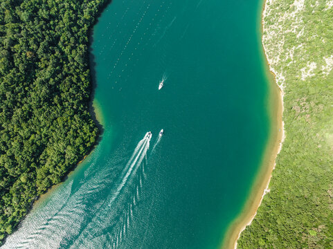 Aerial view of boats sailing along the Limski Fjord (Canal di Leme) in Sveti Lovrec, Istria, Croatia.
