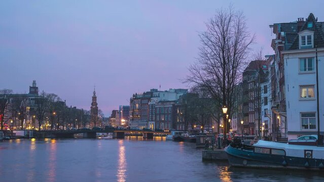 Amsterdam Netherlands time lapse 4K, city skyline day to night timelapse at canal waterfront