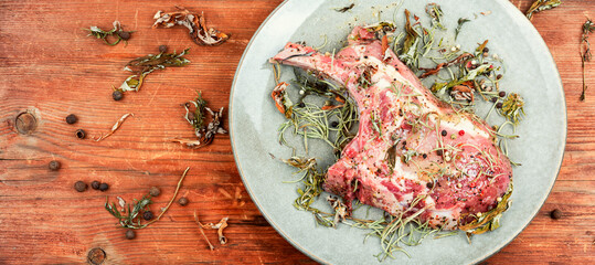 Raw pork steak Tomahawk, space for text.