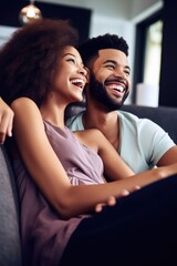 Obraz premium shot of a young couple watching tv together at home