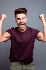 Fototapeta premium cropped shot of a handsome young man cheering while posing in studio