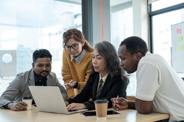 group of business people meeting and brain storming to plan on laptop computer, Creative agency...